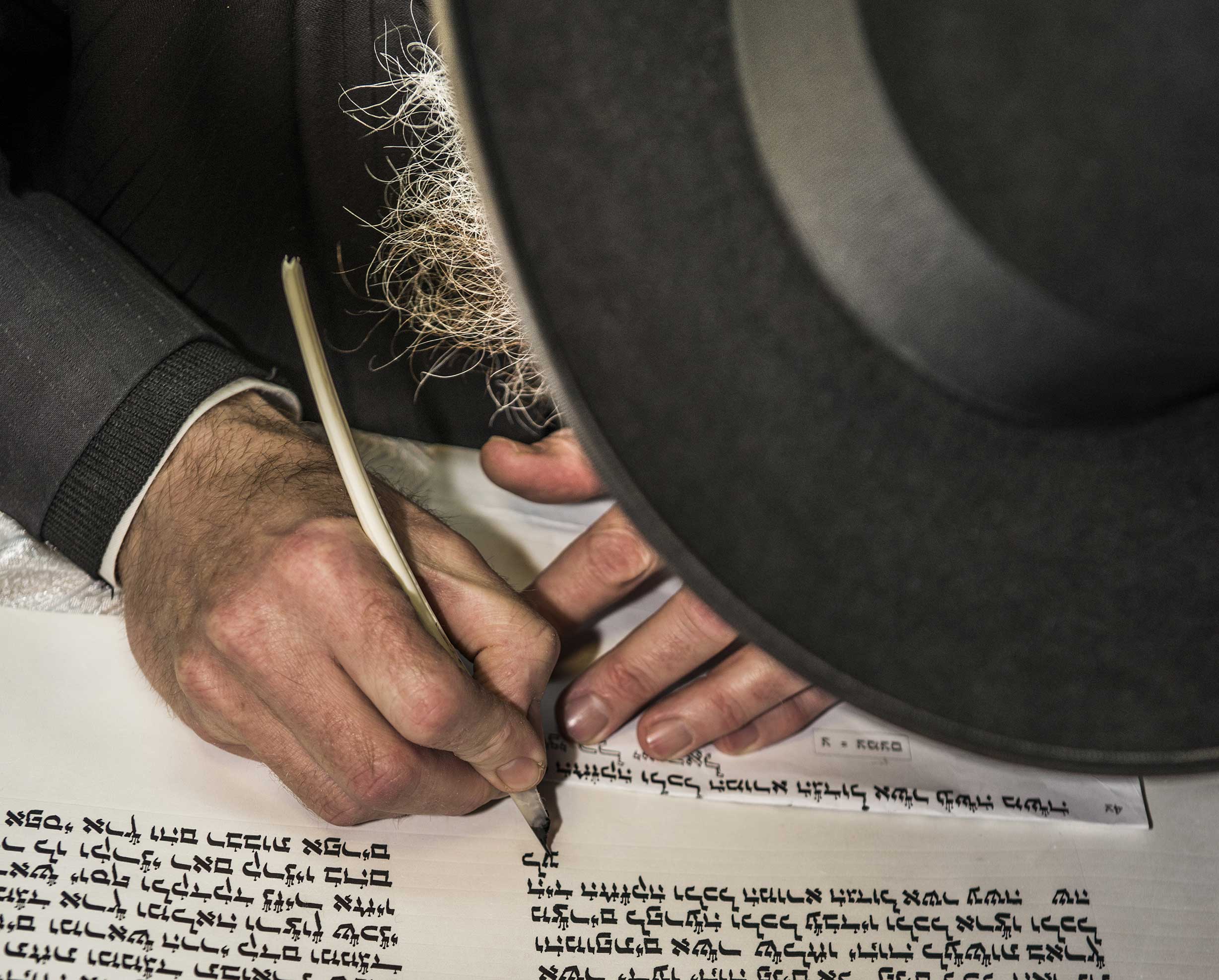 Image of Jewish man writing in Hebrew used for the focal image of The Jewish Evangelism Training Course by CMJ UK