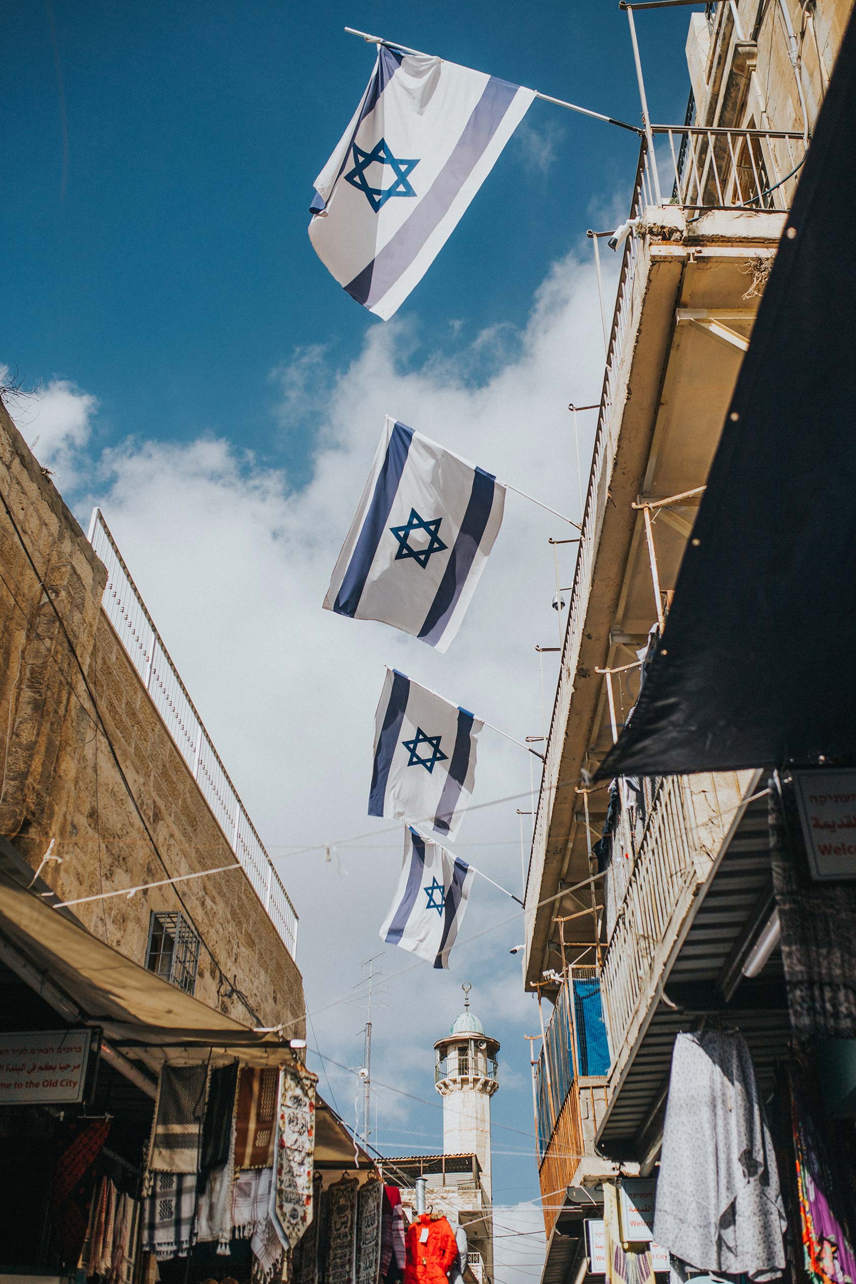 Photo of Israeli flags. Would you like to volunteer in Israel?